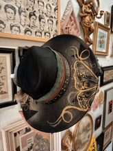 Whimsical butterfly gold hat with trinkets