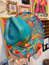Extra colorful with turquoise shimmer peacock hat