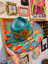 Extra colorful with turquoise shimmer peacock hat