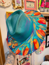 Extra colorful with turquoise shimmer peacock hat