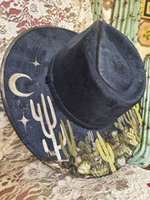 Navy blue hat with green and pearls