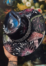 Black raven with beaded hat band