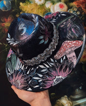 Black raven with beaded hat band