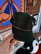 OUTCAST ANTHEM: Black piercing trucker hat