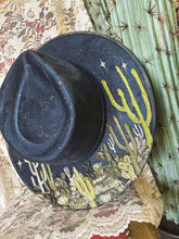 Navy blue hat with green and pearls