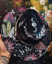 Black raven with beaded hat band