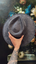 Gray color shifting blue purple under brim