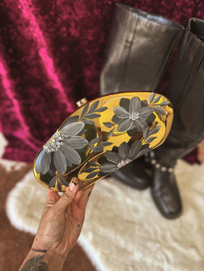 Stadium, friendly gold Crossbody handbag with black florals ￼