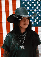 OUTCAST ANTHEM: Cowgirl piercings and chains