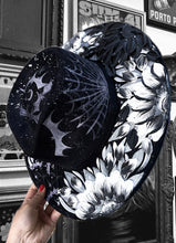 Silver black and white bats and stars