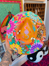 Colorful leopard with shimmer and moons