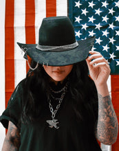 OUTCAST ANTHEM: Cowgirl piercings and chains