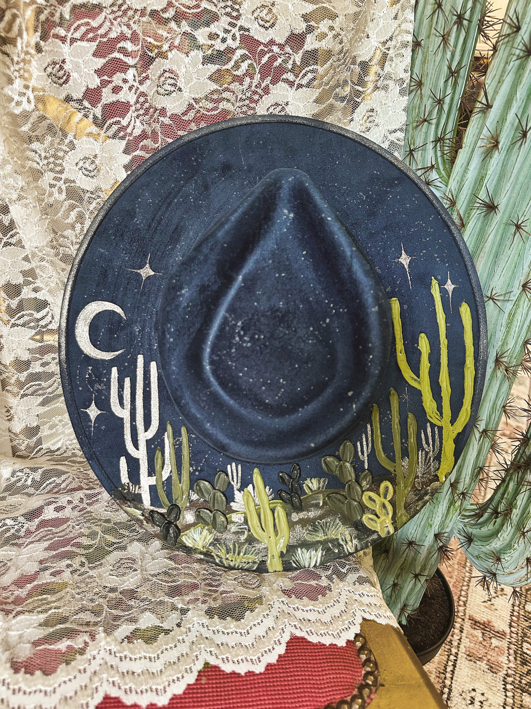 Navy blue hat with green and pearls