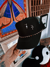 OUTCAST ANTHEM: Black piercing trucker hat