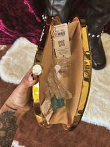 Stadium, friendly gold Crossbody handbag with black florals ￼