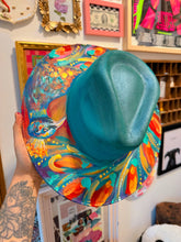 Extra colorful with turquoise shimmer peacock hat