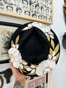 Black floral hat with silver and gold