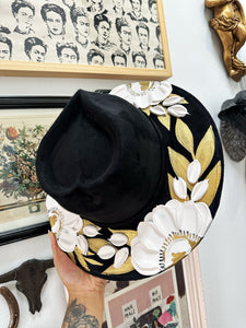 Black floral hat with silver and gold