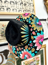 Black blue and pink with gold hat