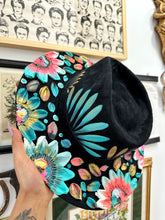 Black blue and pink with gold hat
